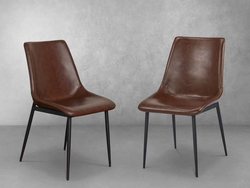 A Pair of Faux Leather Chairs